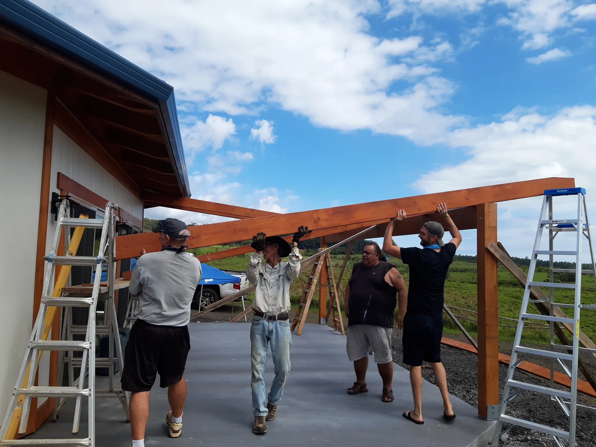 Mau building with workers