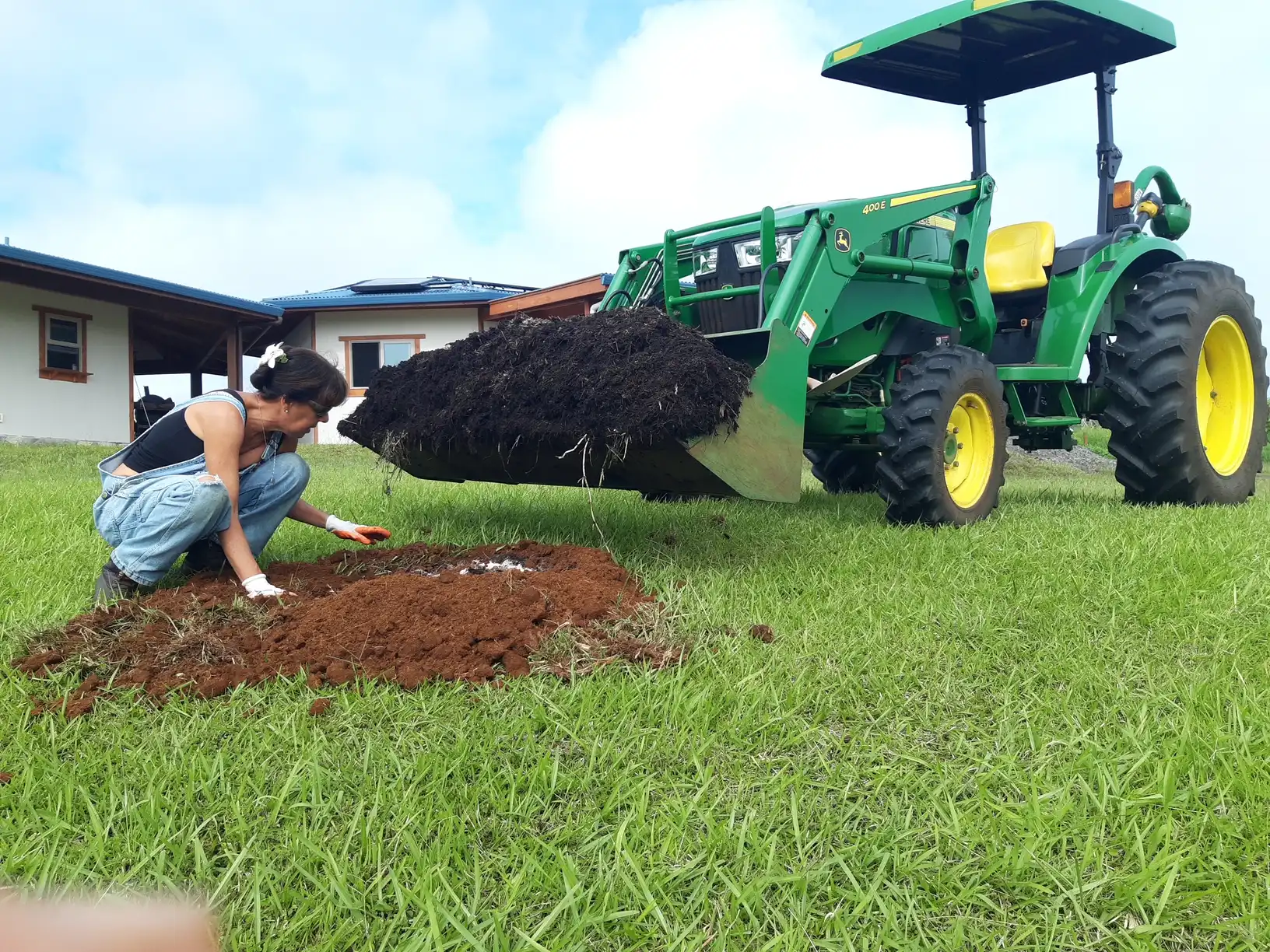 Paola planting a tree on the ranch